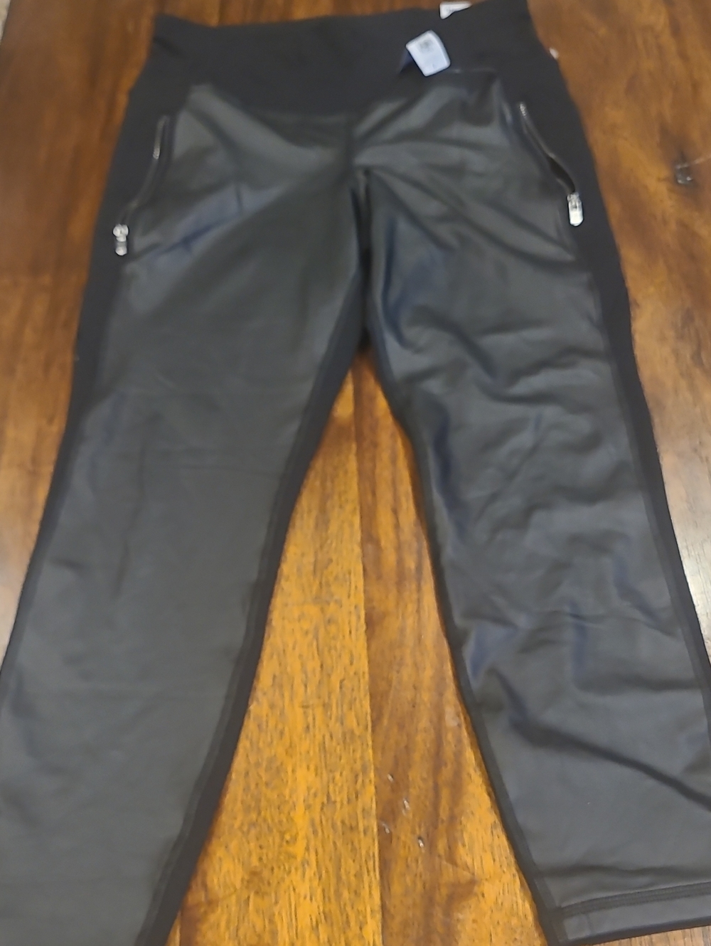 Old Navy black high-rise leggings featuring glossy faux-leather front panels.